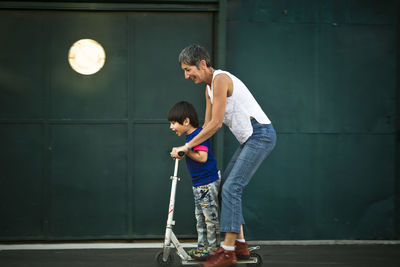 Mother with son on tricycle