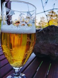 Close-up of beer glass on table