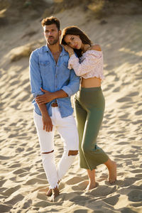 Young couple standing on beach