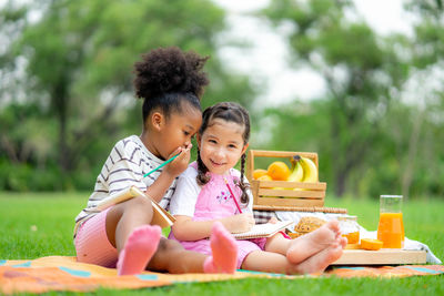 Portrait of a smiling girl sitting with ice cream