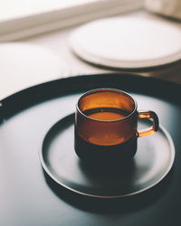 Close-up of coffee cup on table