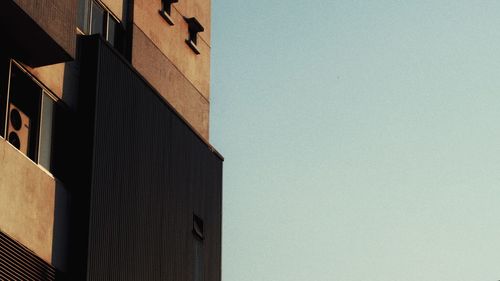 Low angle view of buildings against clear sky