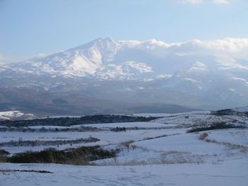 Scenic view of snowcapped mountains against sky