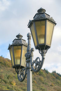 Low angle view of street light against sky