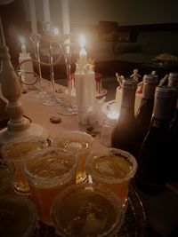 Close-up of wine bottles on table at restaurant