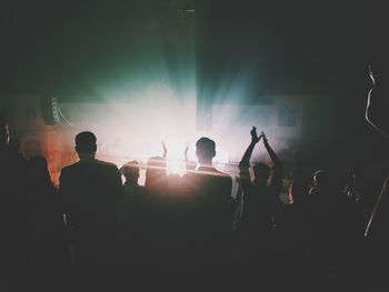 People enjoying music concert at night