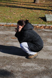 Full length of man standing on footpath
