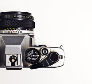 Close-up of camera against white background