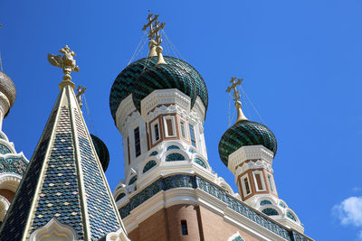 Low angle view of building against blue sky