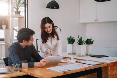 Side view of businesswoman working at office