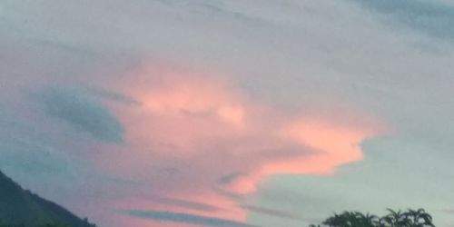 Low angle view of cloudy sky during sunset