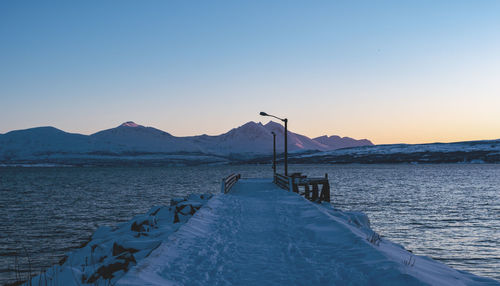 Scenic view of sea against clear sky during sunset