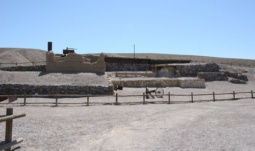 Old abandoned building against clear blue sky