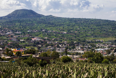 Aerial view of townscape against sky