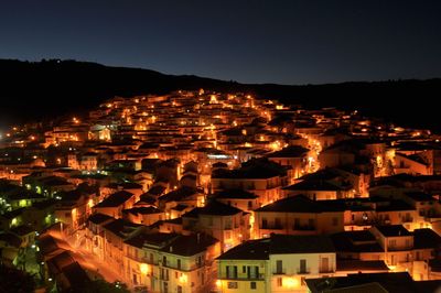 High angle view of illuminated buildings in city at night