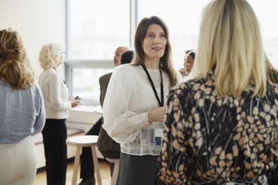 Businesswomen talking during coffee break