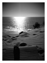 Scenic view of sea against clear sky during sunset