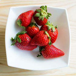 High angle view of strawberries in bowl on table