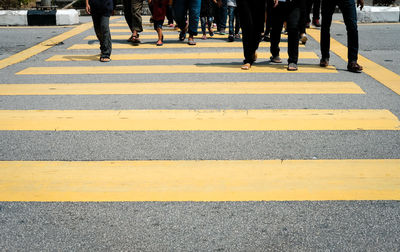 Low section of people crossing road