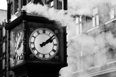 Low angle view of clock on building