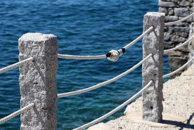 High angle view of ropes on wooden post