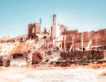 Abandoned building against clear sky