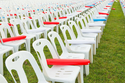 Empty chairs in field