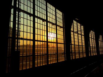 Sky during sunset seen through windows of railroad station