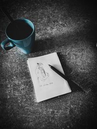 High angle view of coffee cup on table