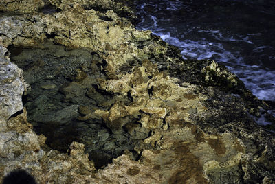 Close-up of rocks in water