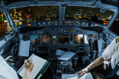 Low angle view of man working at airplane