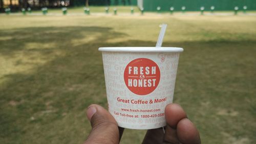 Close-up of hand holding drink