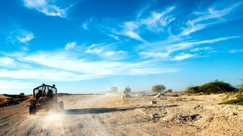 Buggy on dirt road during sunny day