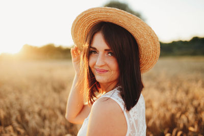 Portrait of smiling woman standing in farm