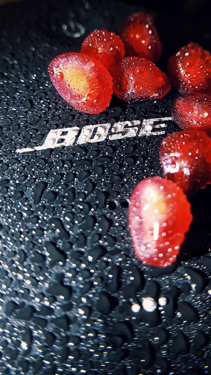 HIGH ANGLE VIEW OF RAINDROPS ON STRAWBERRY