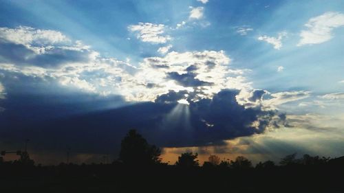 Scenic view of landscape against cloudy sky