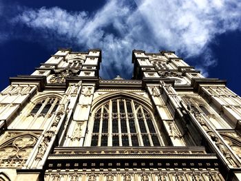 Low angle view of building against cloudy sky