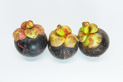 Close-up of fruits against white background