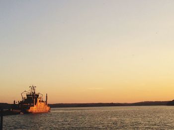 Scenic view of sea against clear sky during sunset