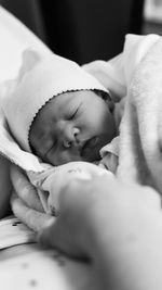 
photograph of a newborn baby in black and white