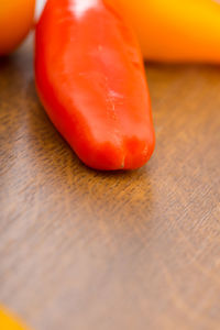 Close-up of orange bell peppers on table