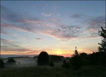 Scenic view of landscape at sunset