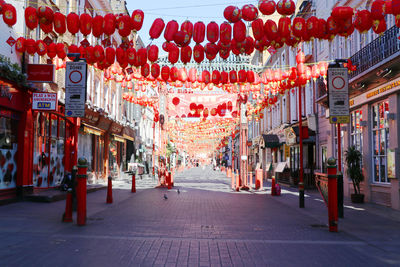 View of lanterns hanging on street in city