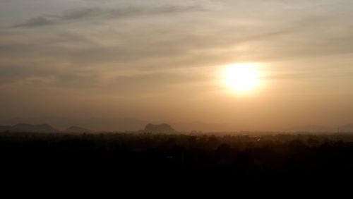 Scenic view of silhouette landscape against sky during sunset