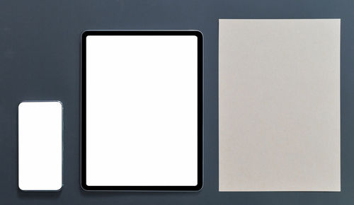 Low angle view of mobile phone against white background