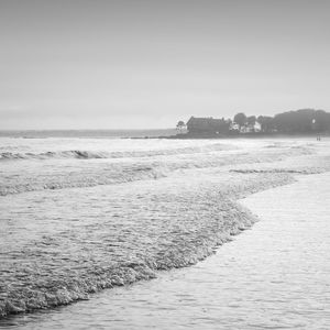 Scenic view of beach against clear sky