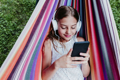 Happy girl using mobile phone