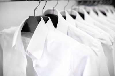 Close-up of clothes hanging on rack