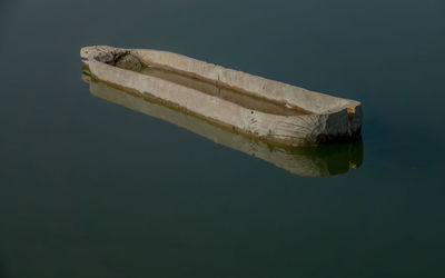 High angle view of boat floating on lake