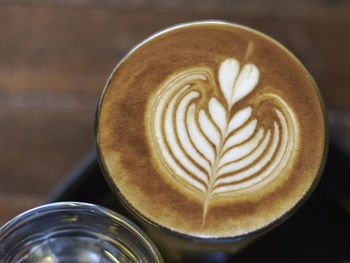 Close-up of cappuccino served on table